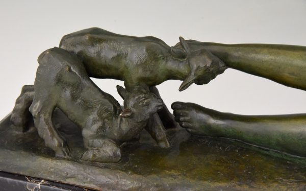 Art Deco bronze sculpture of a reclining nude with goats