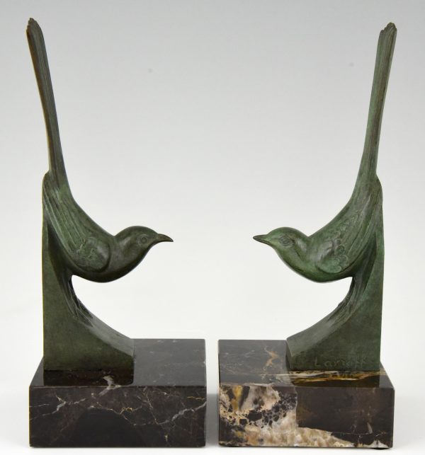 Art Deco bronzen boekensteunen vogels