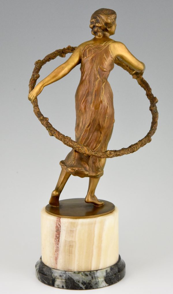 Art Deco bronze sculpture of a girl with hoop.