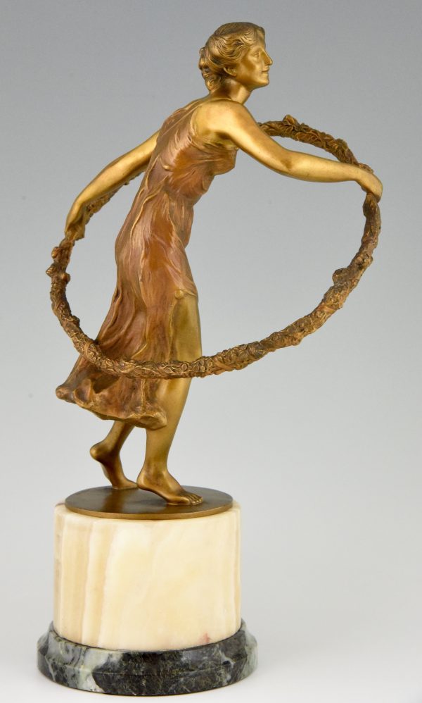 Art Deco bronze sculpture of a girl with hoop.