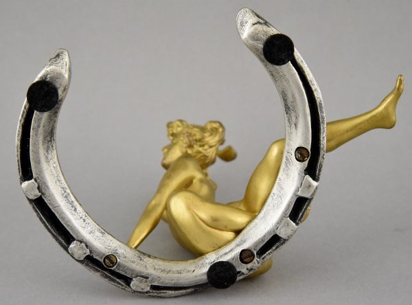 Art Nouveau bronze nude on a horseshoe