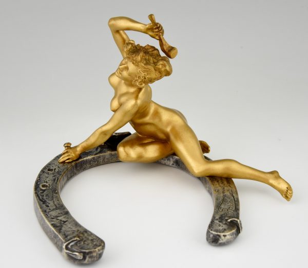 Art Nouveau bronze sculpture nude on a horseshoe