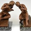 Art Deco bookends man with music book and woman with lyre
