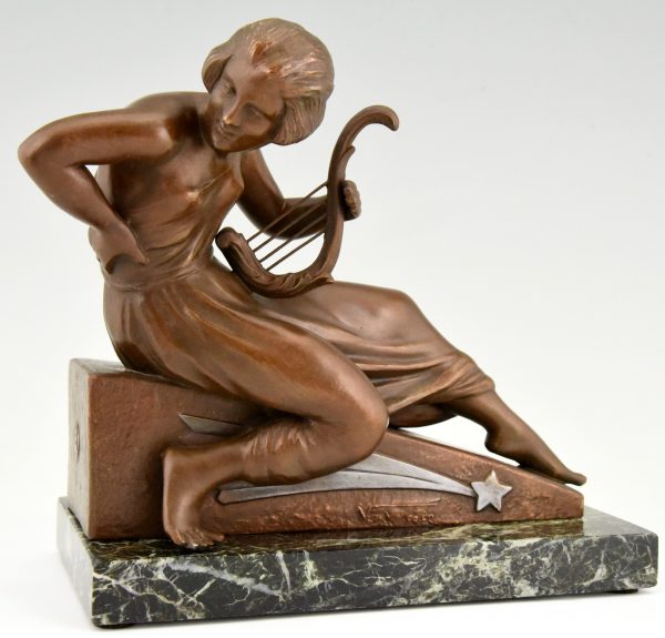 Art Deco bookends man with music book and woman with lyre