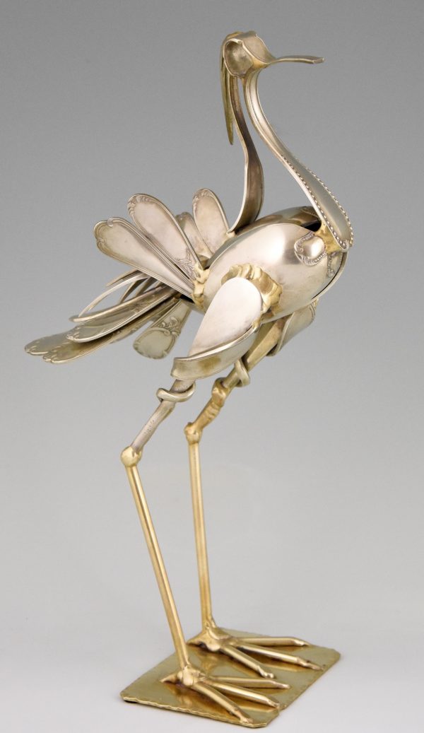 Cutlery sculpture of a bird.