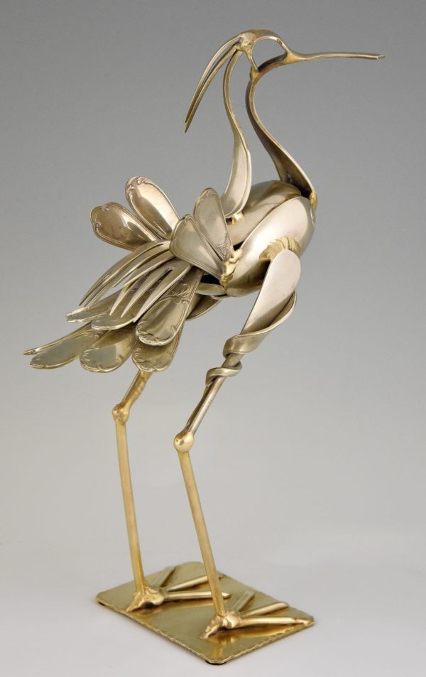 Cutlery sculpture of a bird.