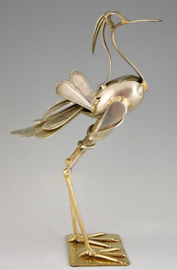 Cutlery sculpture of a bird.