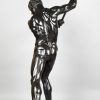 Half size sculpture male nude with sledgehammer 