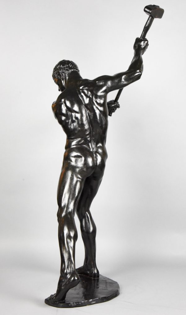 Half size sculpture male nude with sledgehammer 