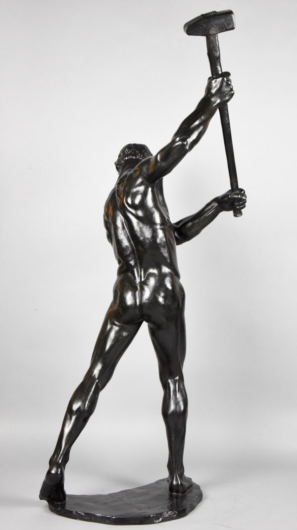 Half size sculpture male nude with sledgehammer 