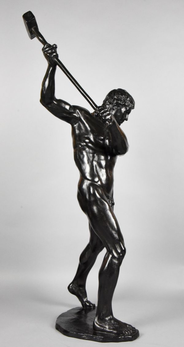 Half size sculpture male nude with sledgehammer 