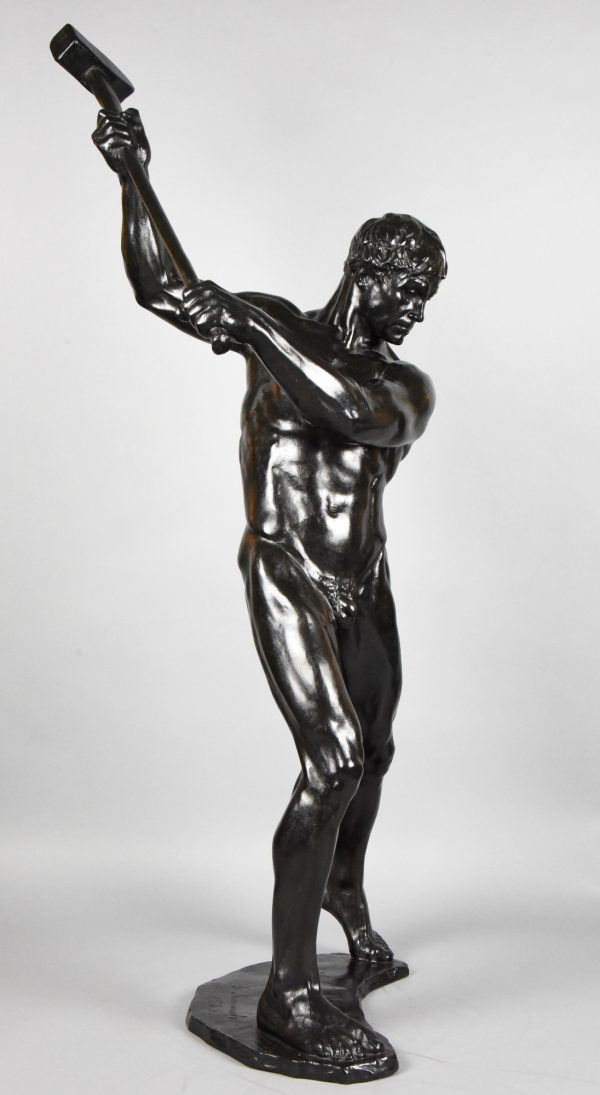 Half size sculpture male nude with sledgehammer 