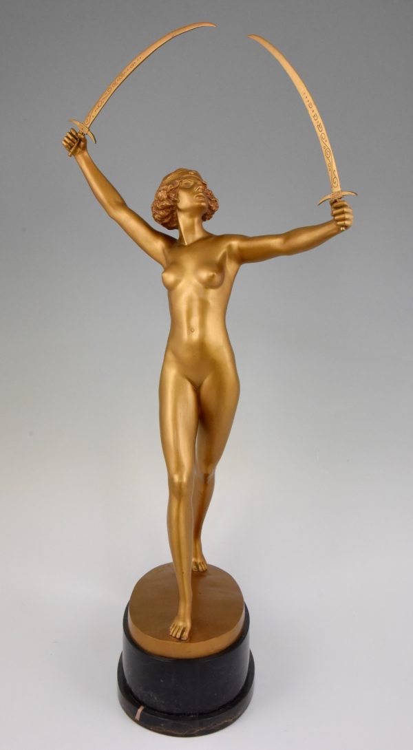 Art Deco gilt bronze sculpture of a nude with two swords.