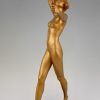 Art Deco gilt bronze sculpture of a nude with two swords.