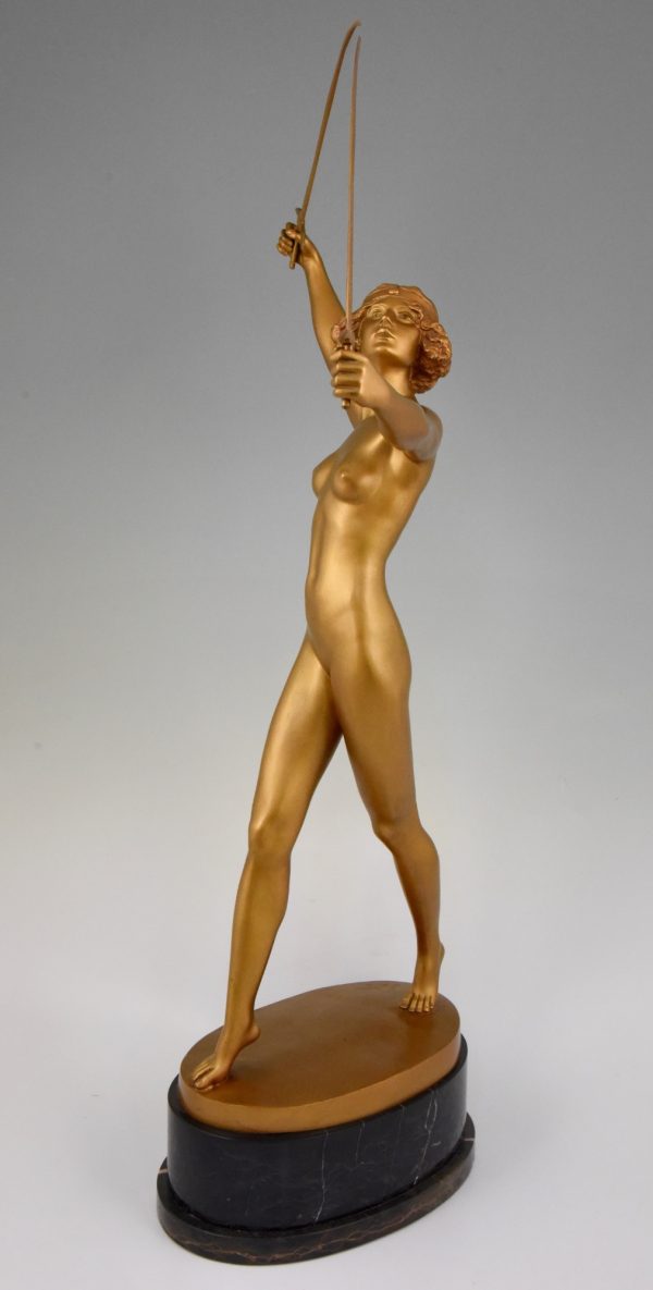 Art Deco gilt bronze sculpture of a nude with two swords.