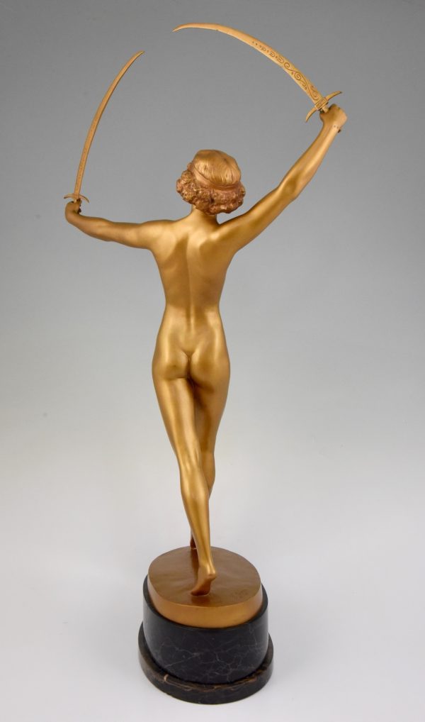 Art Deco gilt bronze sculpture of a nude with two swords.