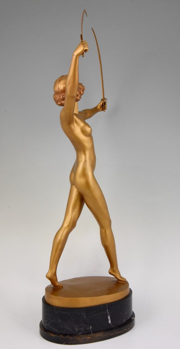 Art Deco gilt bronze sculpture of a nude with two swords.