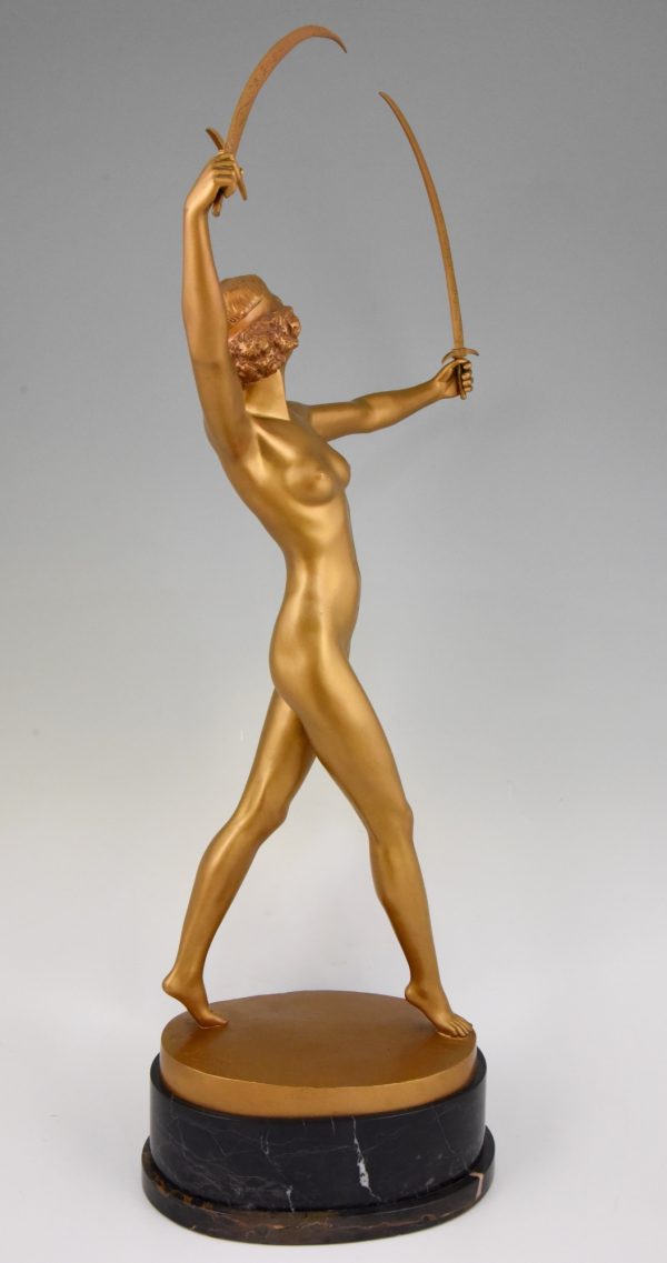 Art Deco gilt bronze sculpture of a nude with two swords.