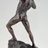 Antique bronze sculpture athletic male nude lifting stone