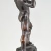 Antique bronze sculpture athletic male nude lifting stone