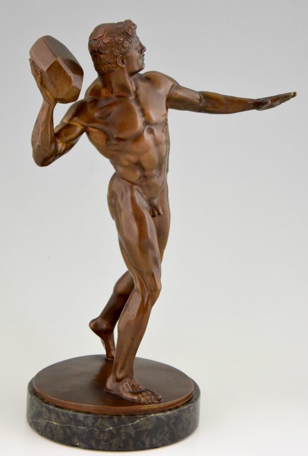 Antique bronze sculpture male nude throwing stone