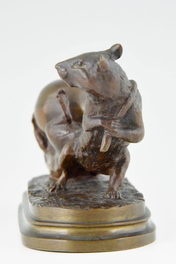 Antique bronze of two mice with egg