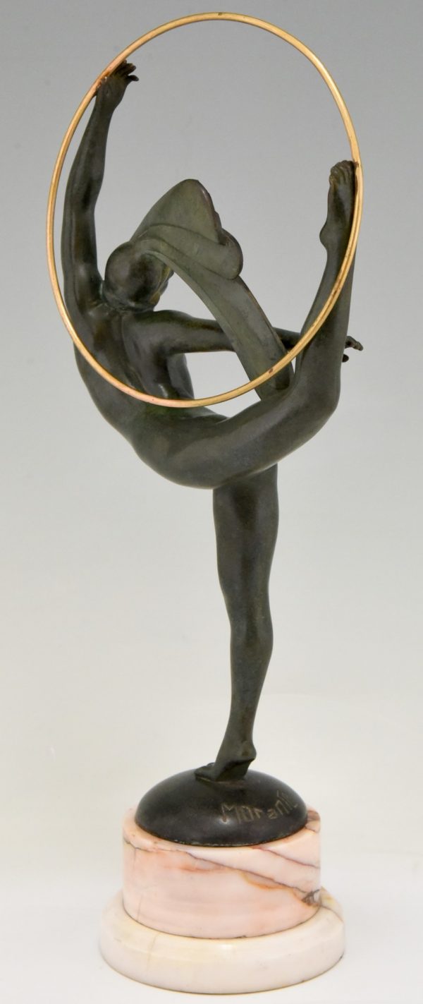 Art Deco bronze hoop dancer with feathered headdress