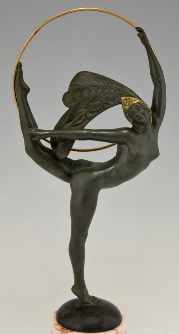 Art Deco bronze hoop dancer with feathered headdress