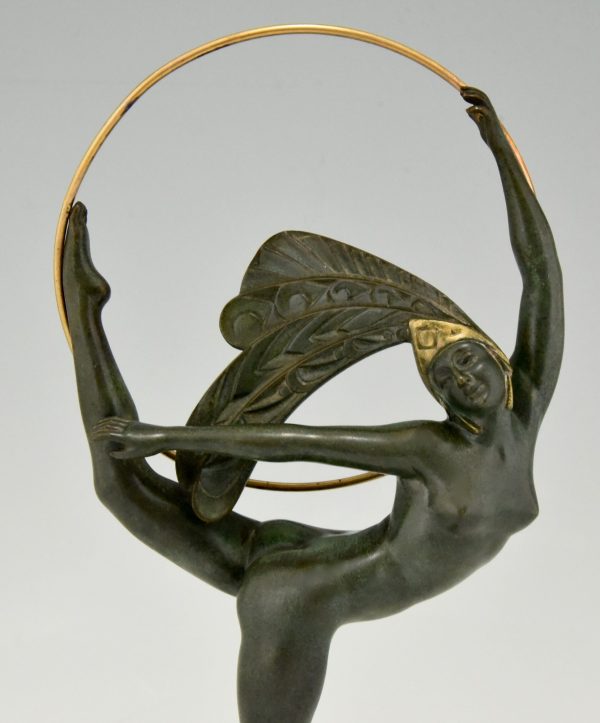 Art Deco bronze hoop dancer with feathered headdress