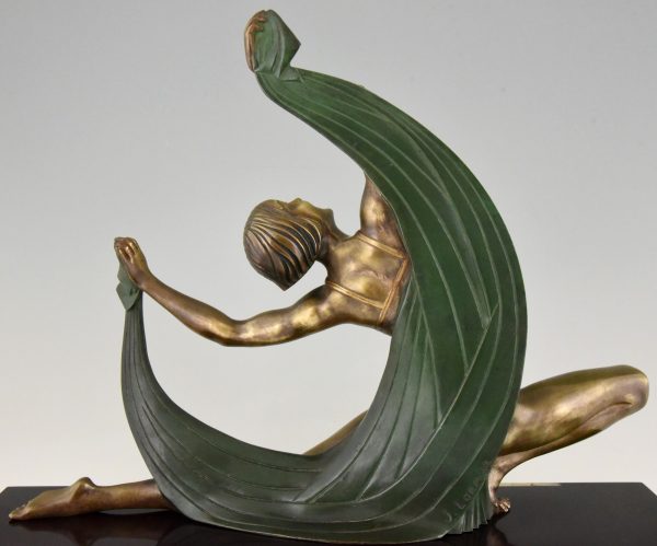 Art Deco bronze sculpture of a scarf dancer on sunburst base