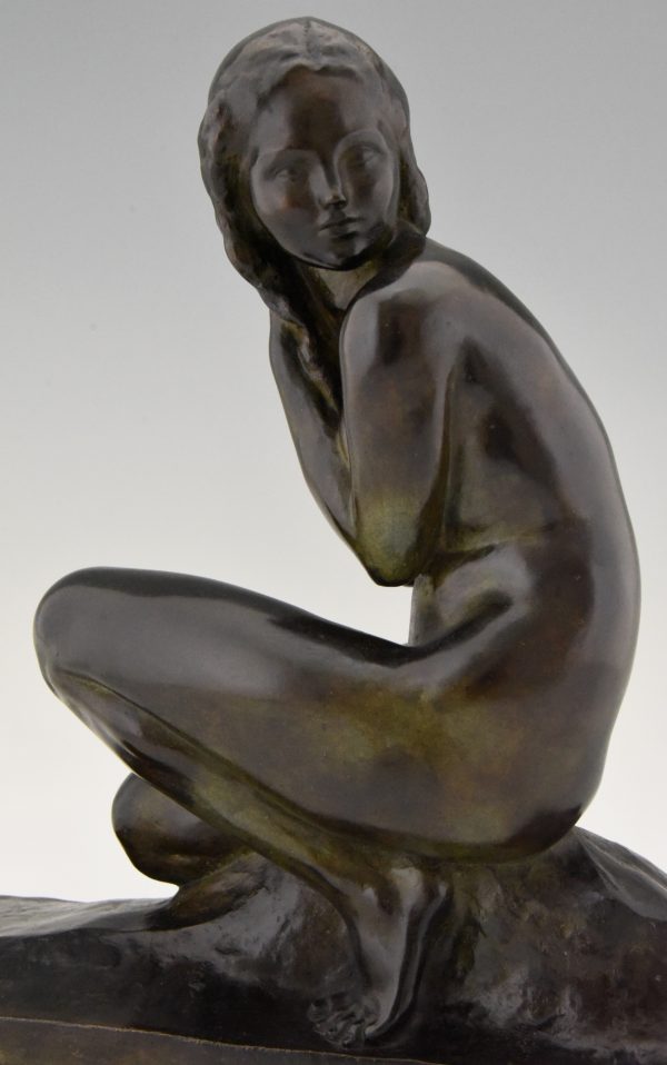 Art Deco bronze sculpture of a seated nude