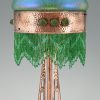 Art Nouveau copper table lamp with Loetz glass shade.