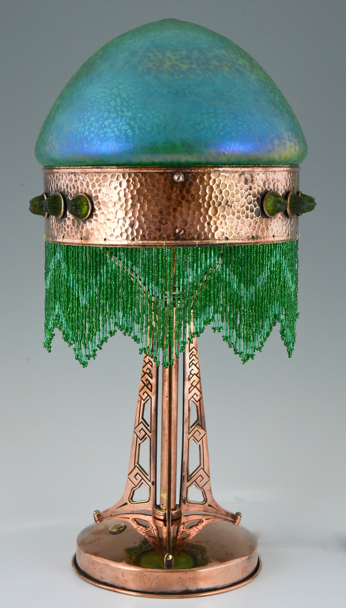 Art Nouveau copper table lamp with Loetz glass shade. Deconamic