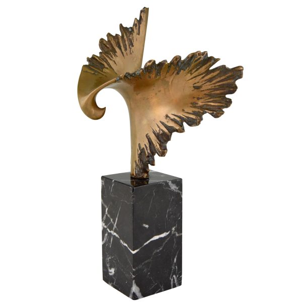 Bronze sculpture of a stylized eagle