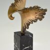 Bronze sculpture of a stylized eagle