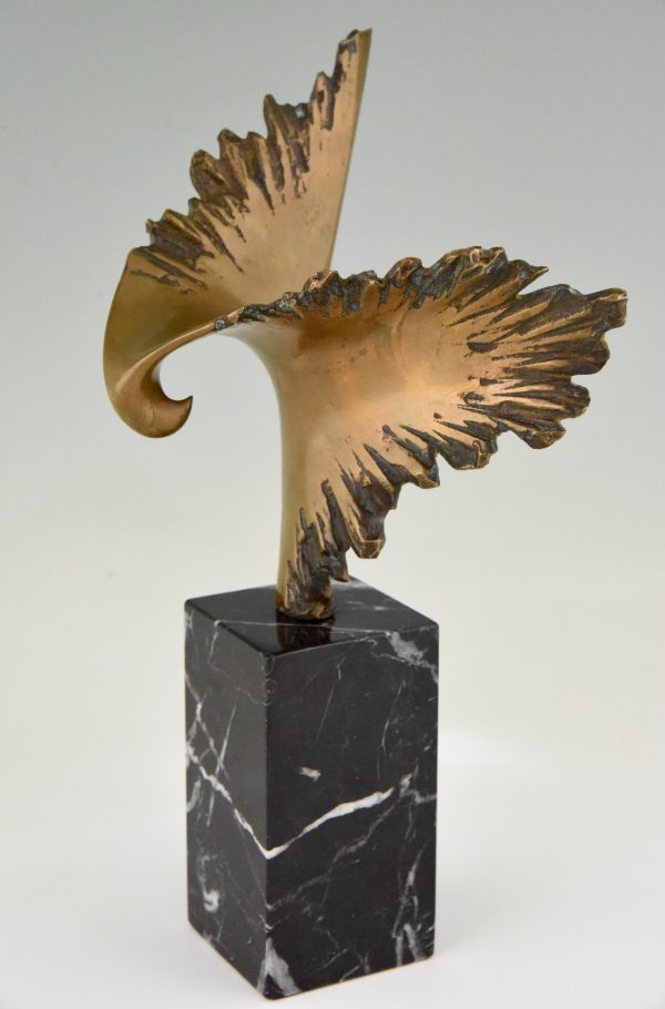 Bronze sculpture of a stylized eagle