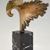 Bronze sculpture of a stylized eagle