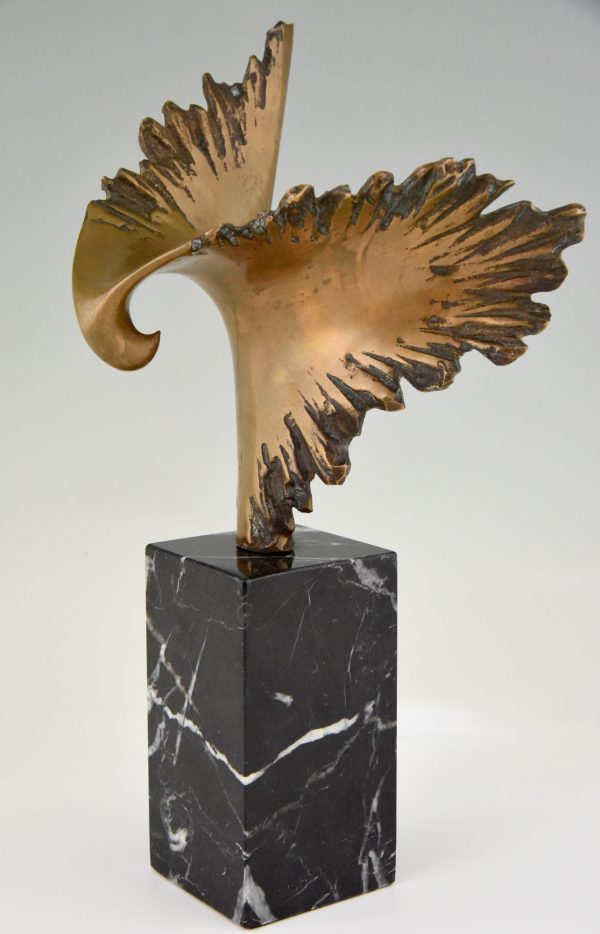 Bronze sculpture of a stylized eagle