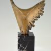 Bronze sculpture of a stylized eagle