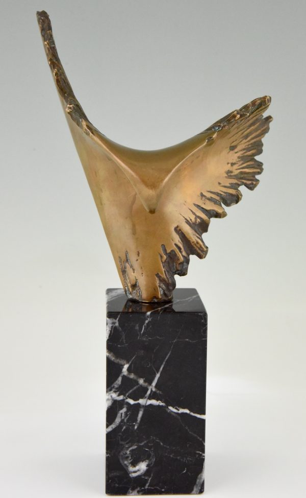 Bronze sculpture of a stylized eagle