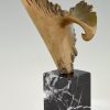 Bronze sculpture of a stylized eagle