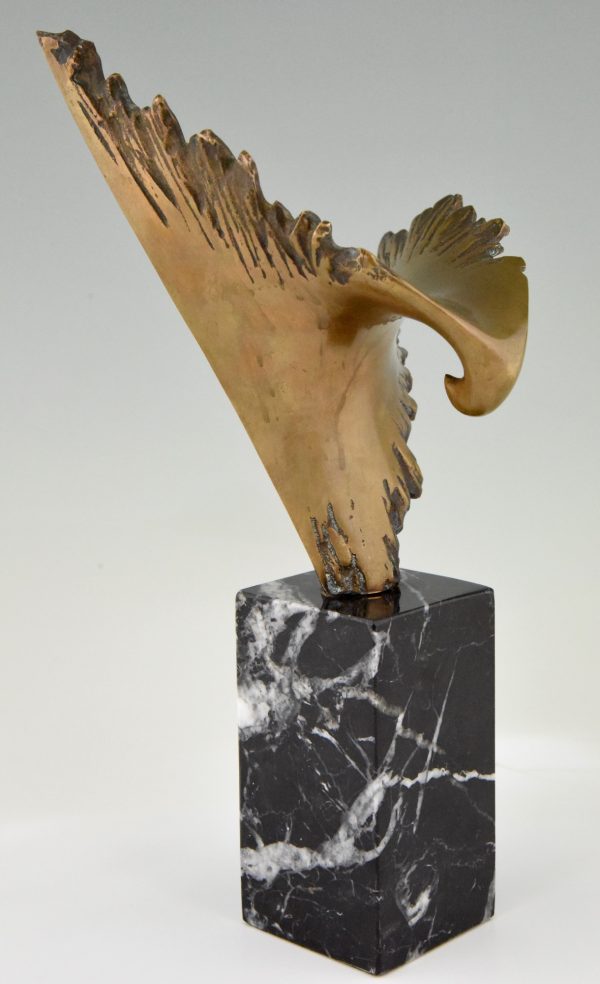 Bronze sculpture of a stylized eagle