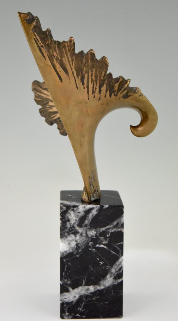 Bronze sculpture of a stylized eagle