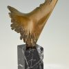 Bronze sculpture of a stylized eagle