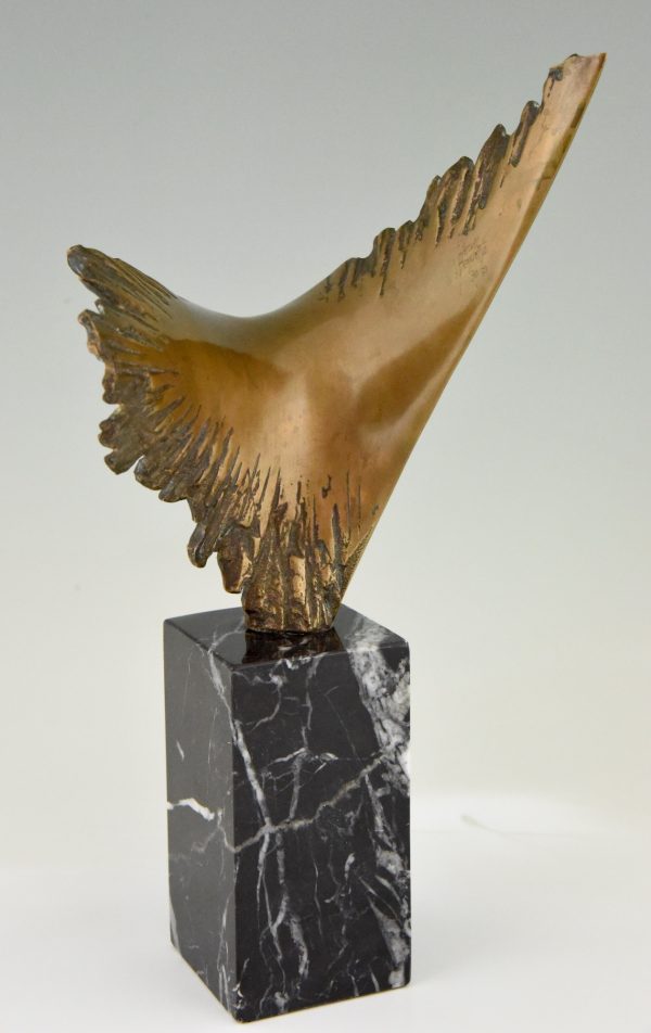 Bronze sculpture of a stylized eagle