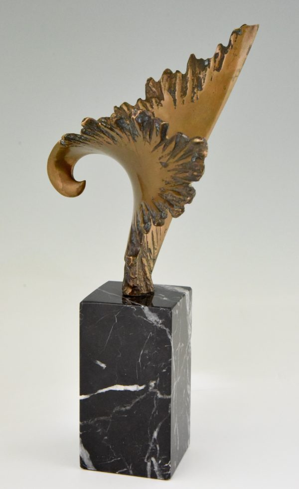 Bronze sculpture of a stylized eagle