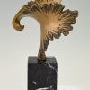 Bronze sculpture of a stylized eagle