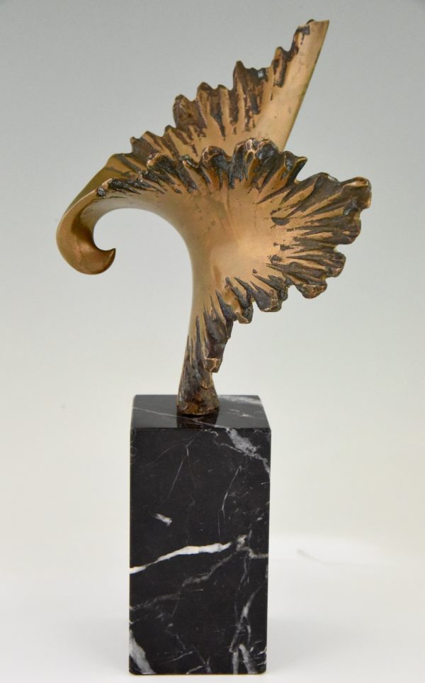 Bronze sculpture of a stylized eagle