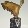 Bronze sculpture of a stylized eagle