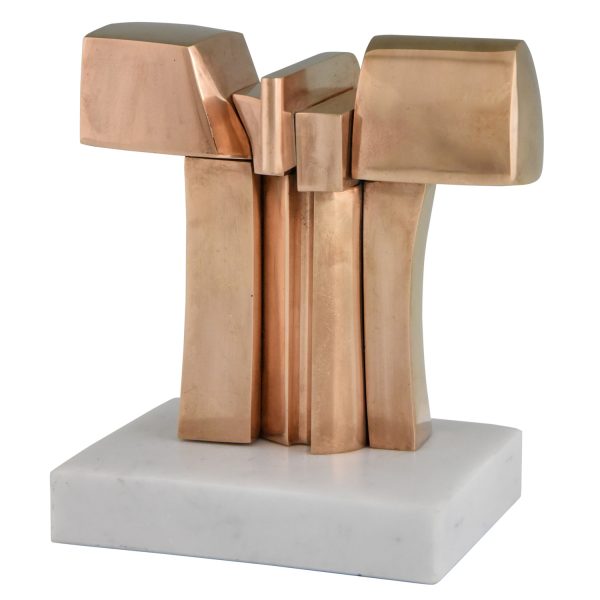 Bronze abstract sculpture on a white marble base